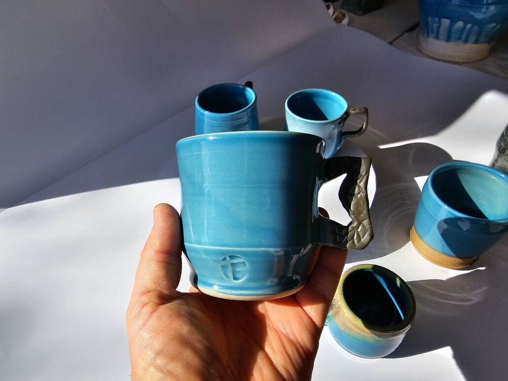 Handheld blue cup