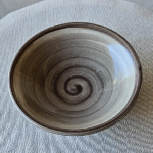 The Cima Volcanic Mountain 3 Bowl Set is the result of glaze experimentation where the color results did not end up as expected. The swirl inside was supposed to be a red called brandywine but due to an interesting chemical reaction they are warm gray.